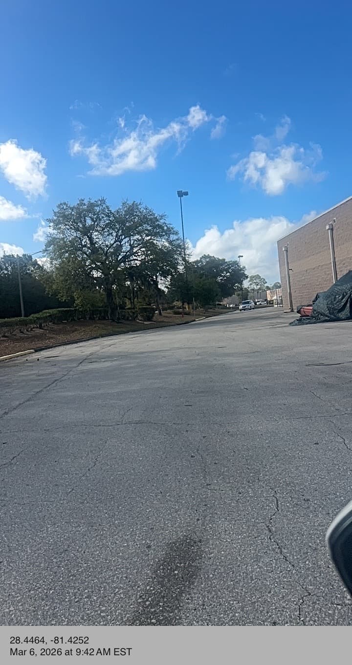 Commercial building side debris vacant property check Orlando FL