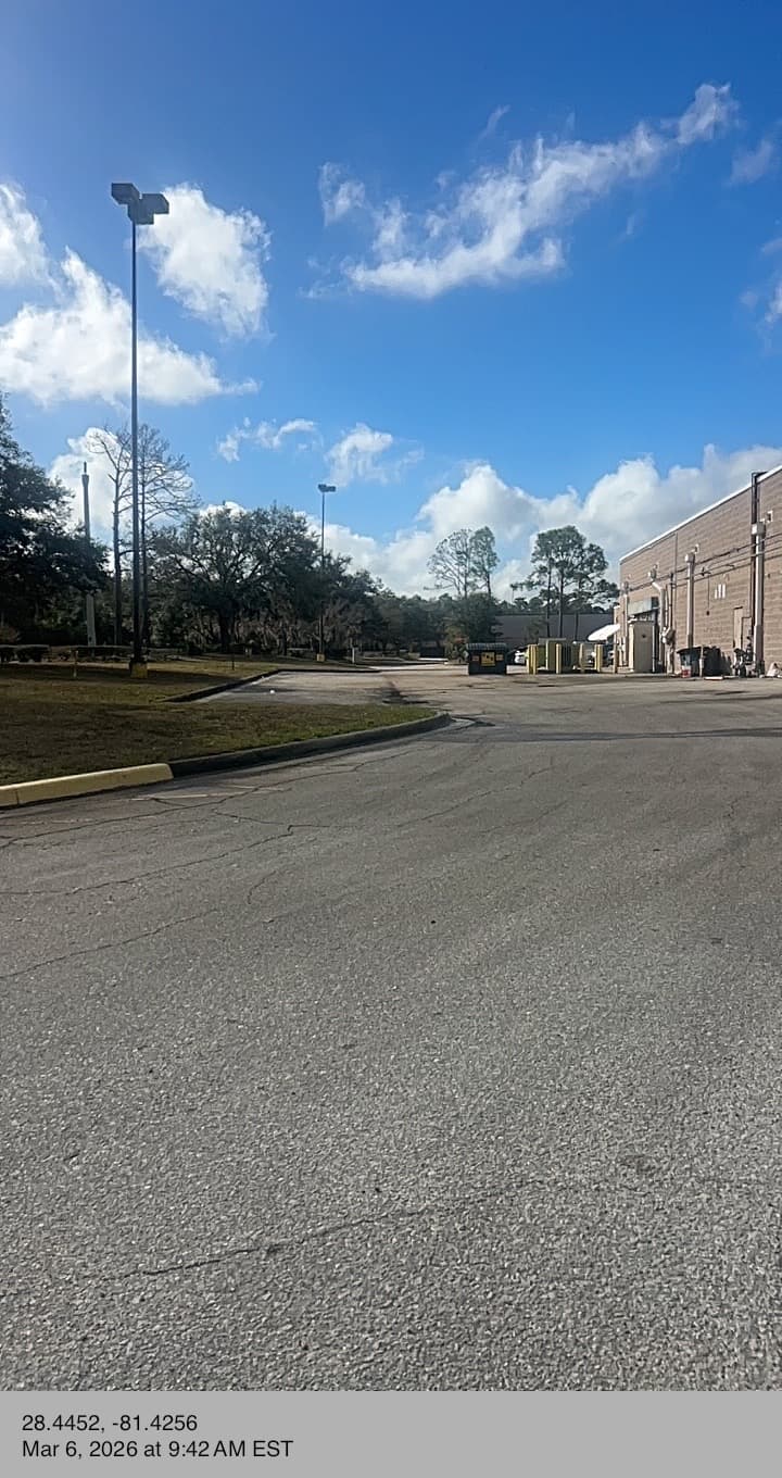 Loading area back of commercial building debris cleanup Orlando FL